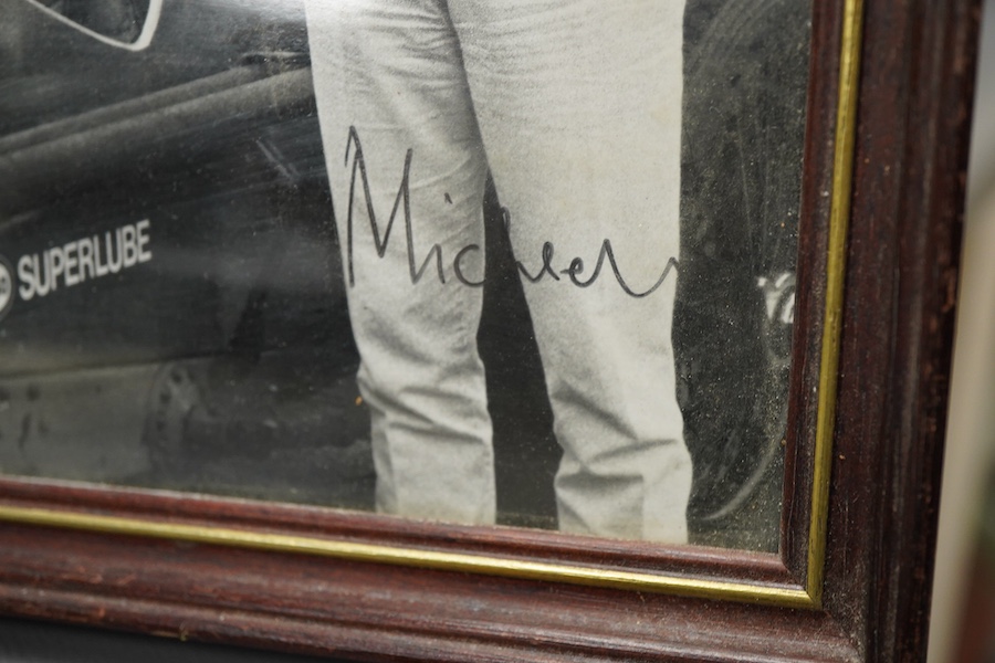 Racing ephemera, including; a Moto-lite steering wheel, a driver's leather cap, an enamelled Le Mans pilot’s radiator badge, signed photograph of Prince Michael Kent standing next to a 12 cylinder single seat racing car